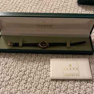 Gucci Black and Gold Watch